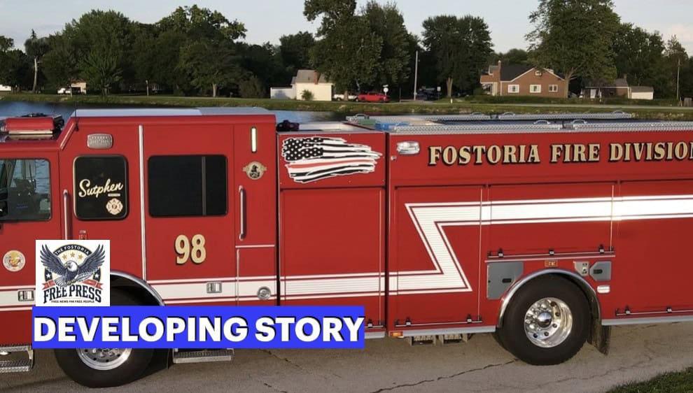 Fostoria News Fostoria Fire Division fire truck with developing story banner.